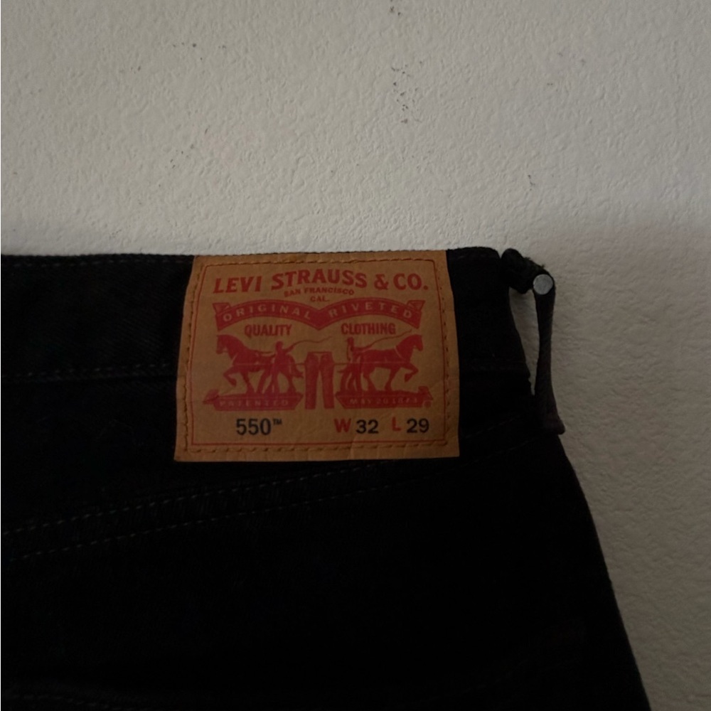 Levi's 550 Relaxed Fit Jeans in Black with Tan Patch